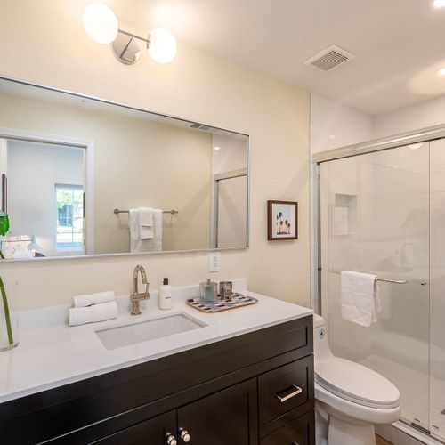 Full bathroom 4 with walk-in glass shower (ensuite to bedroom 6)