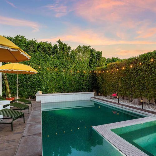 Pool and hot tub with sun loungers