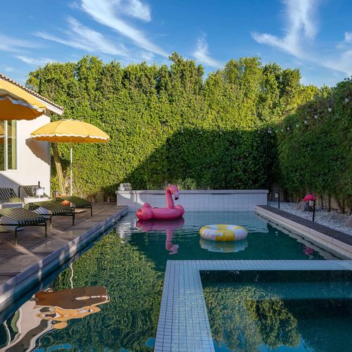 Pool and hot tub with sun loungers
