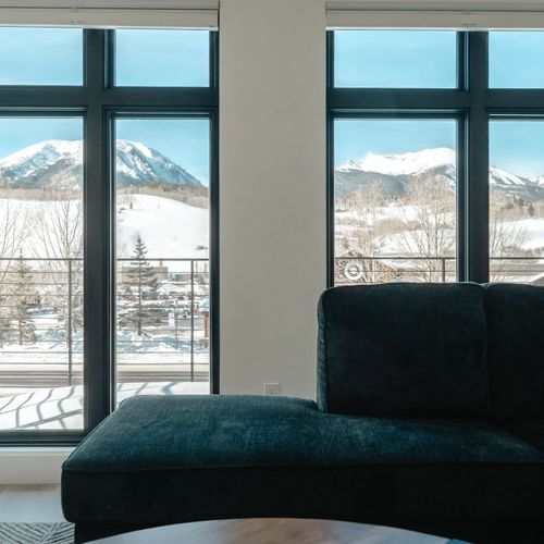 Main living area seating and balcony + Super Target across the highway