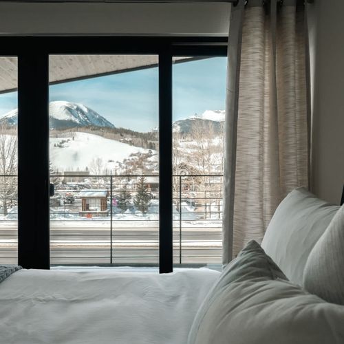 Primary bedroom with private balcony view