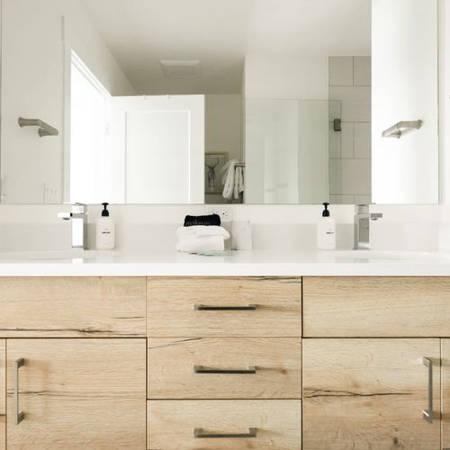 Primary bathroom with dual vanities