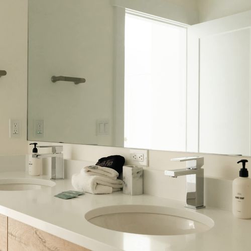 Full bathroom 2 with dual vanities