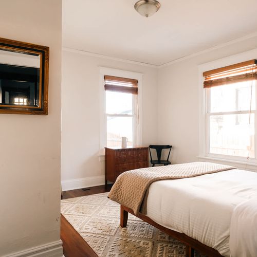 Main level bedroom with queen bed