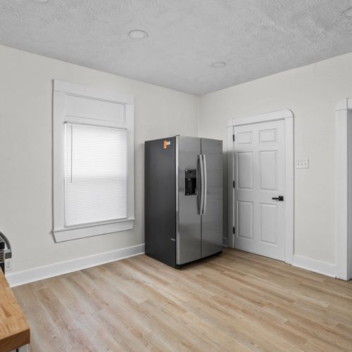 Step inside the modern renovated kitchen! Complete with new cabinets, backsplash, butcher block counters, and sparkling new appliances!