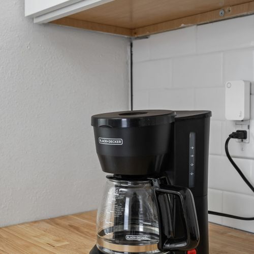 Coffee lover? We have you covered! A coffee maker, coffee grounds, and all the fixings are ready to brew your perfect cup!