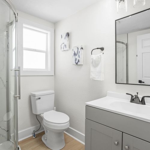 Leading from the kitchen is your downstairs full bathroom. Complete with a shower, vanity, and the essentials!