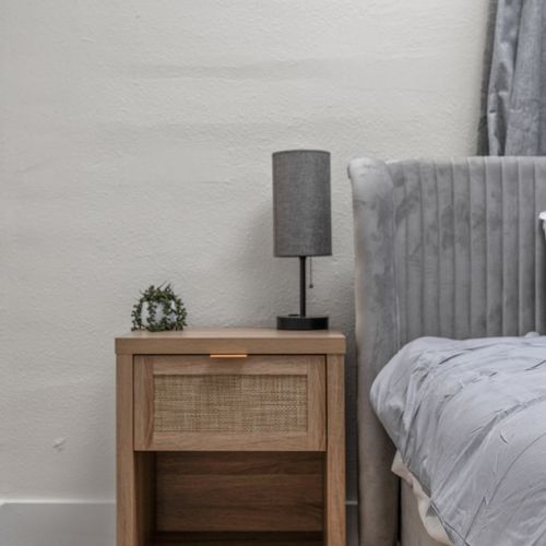 A thoughtful nightstand with storage and lamp for your convenience!