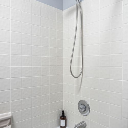 Downstairs shower featuring Shampoo, Conditioner, and Body Wash to get you started on your stay!