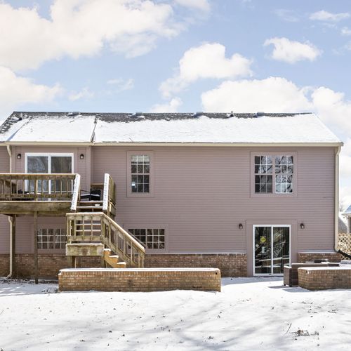 Our backyard features a deck upstairs, and outdoor furniture to enjoy!