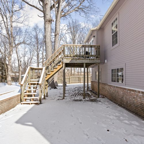 Our backyard features a deck upstairs, and outdoor furniture to enjoy!