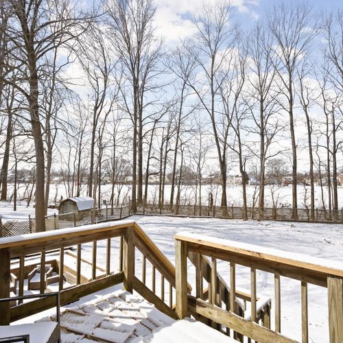 Our backyard features a deck upstairs, and outdoor furniture to enjoy!