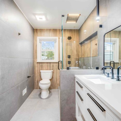 Stylish and modern bathroom with a spacious shower and double vanity.