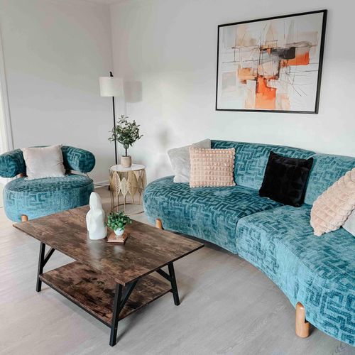 Step into this stylish and cozy living space, where plush seating, modern decor, and a warm ambiance invite you to relax and unwind. The perfect spot to feel at home during your stay!