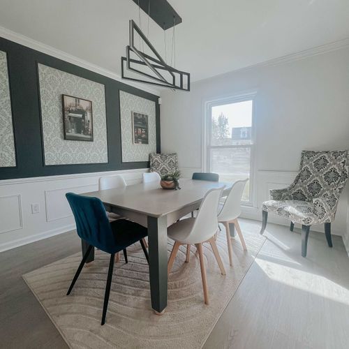 A stylish dining area with ample seating, modern lighting, and a cozy ambiance—perfect for enjoying meals together.