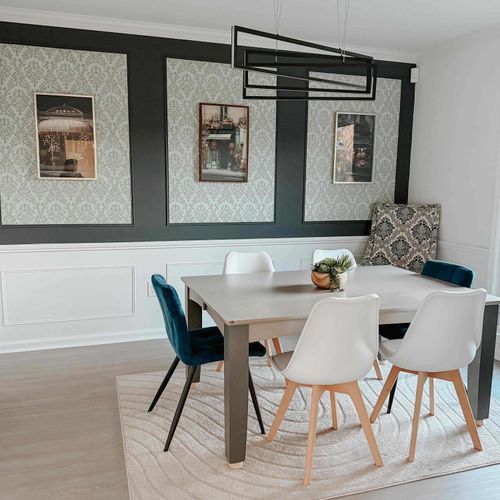 A stylish dining area with ample seating, modern lighting, and a cozy ambiance—perfect for enjoying meals together.