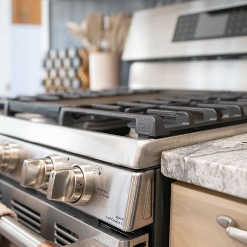 Modern kitchen with a stainless steel gas range, perfect for cooking up delicious meals.