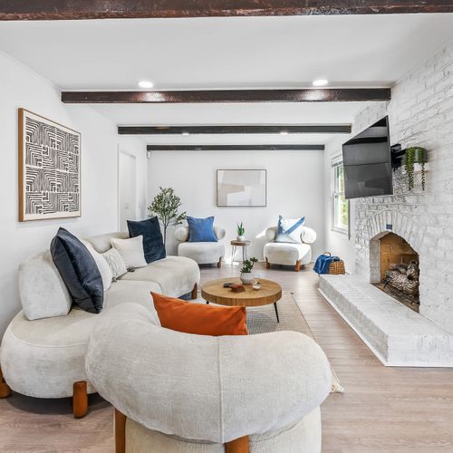 Step into this stylish and cozy living space, where plush seating, modern decor, and a warm ambiance invite you to relax and unwind. The perfect spot to feel at home during your stay!