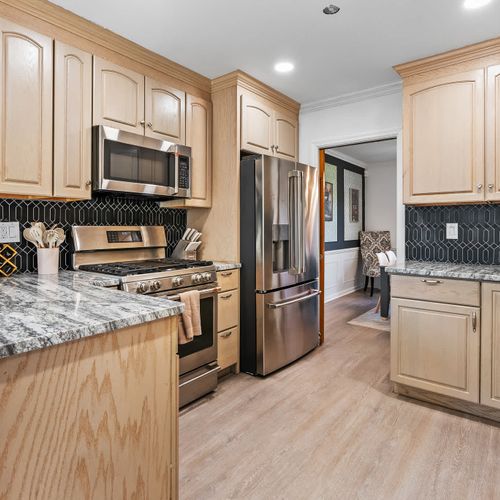 Step into a kitchen that feels like home—with a touch of luxury! Featuring sleek marble countertops, a chic backsplash, and top-notch appliances, this stylish space is perfect for cooking, gathering, and making delicious memories.