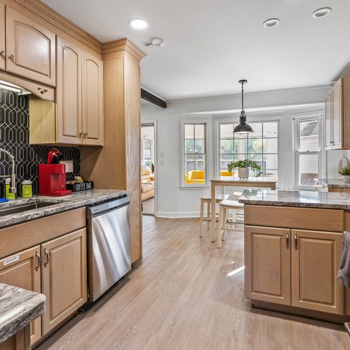 Spacious kitchen with modern appliances and charming breakfast nook — perfect for enjoying your morning coffee!