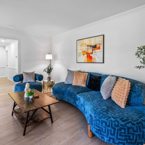 Stylish comfort meets modern elegance! Relax in this beautifully designed living space with plush seating, chic decor, and a cozy ambiance—perfect for unwinding or entertaining.