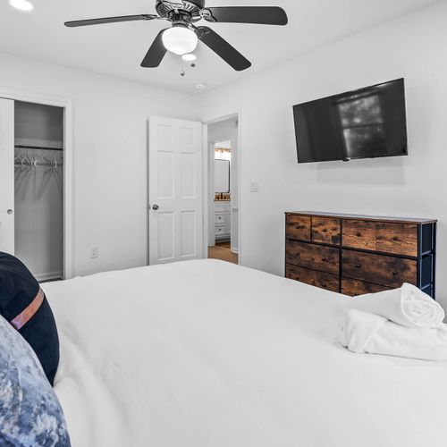 Cozy and inviting bedroom with modern touches, a spacious closet, and easy ensuite access.
