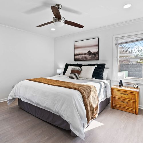 Serene master bedroom with a king bed, natural light, and calming views.