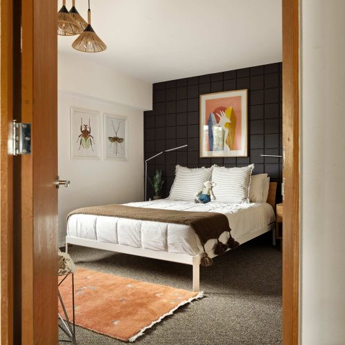 Main level bedroom with queen bed