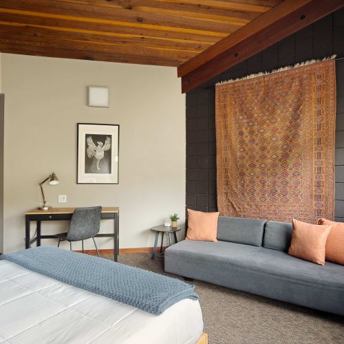 Bedroom 2 with desk and additional seating