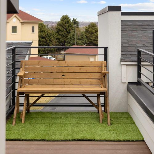 Bench on rooftop deck converts into a picnic table