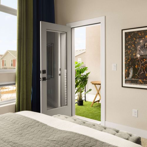 Primary bedroom with private balcony