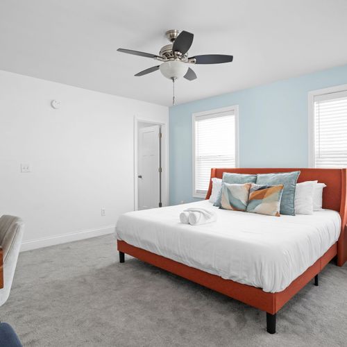 Primary Bedroom: This room features our Blue Jewel theme and embraces Indianapolis' vibrant aesthetic!