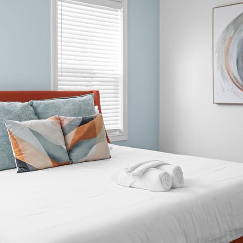Primary Bedroom: This room features our Blue Jewel theme and embraces Indianapolis' vibrant aesthetic!