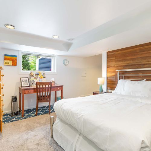 Downstairs bedroom with a full size bed.