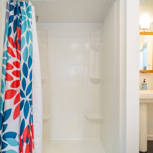 Downstairs bathroom with a stand up shower.