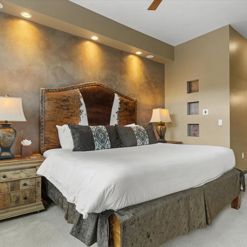 Primary bedroom with king bed and en suite bathroom