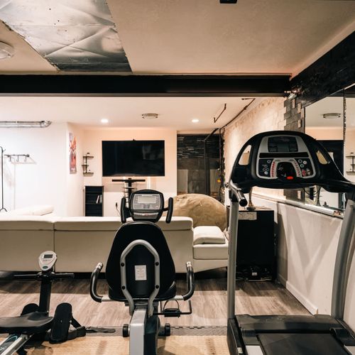 Home gym and living area in the basement