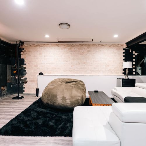 Basement living area with LED lights that coordinate with the TV