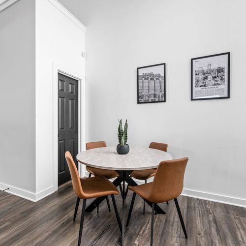 Dining table for four with the best views of Indianapolis above, plus 4 bar stools at the countertop for extra seating!