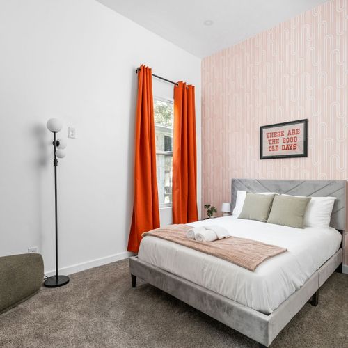 Retro flair with pink wallpaper, bold colors, and a feel-good reminder: these are the good old days.