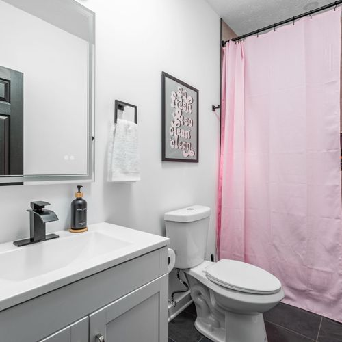 Full hallway bathroom with a smart mirror and bold style—where sophistication meets function!