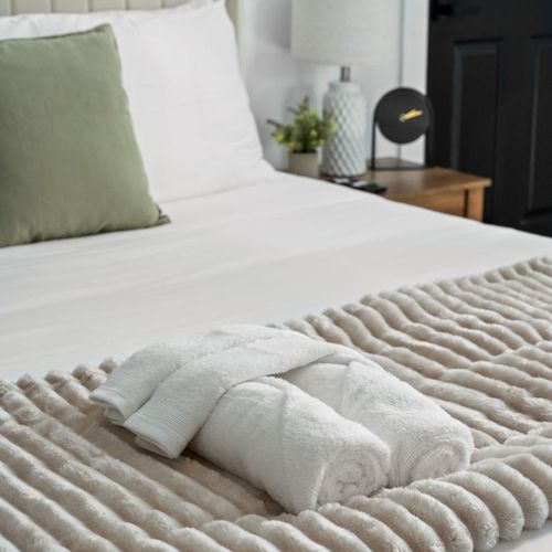High-quality linens and rolled towels—pure luxury made for your ultimate relaxation.