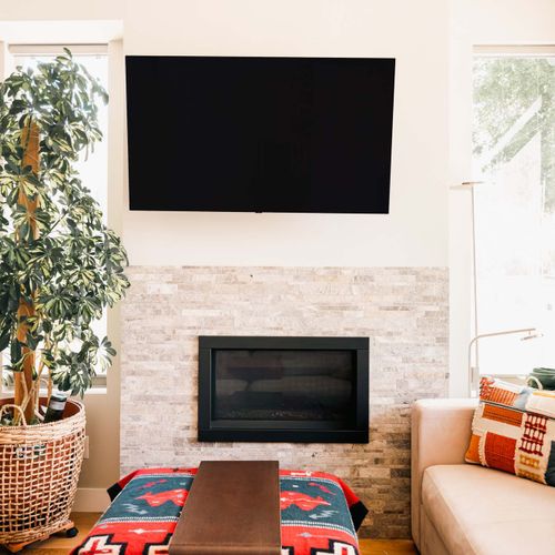 Living area with flatscreen TV and gas fireplace
