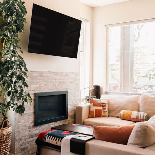 Living area with seating, TV, and gas firepalce
