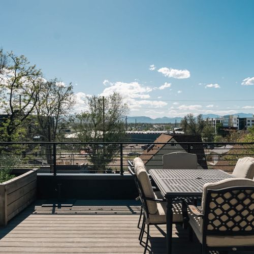 Rooftop deck dining area with a Rocky Mountain view
