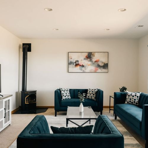 Lower-level living room with seating and a smart TV
