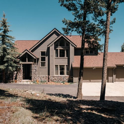 Home exterior showing 3-car garage