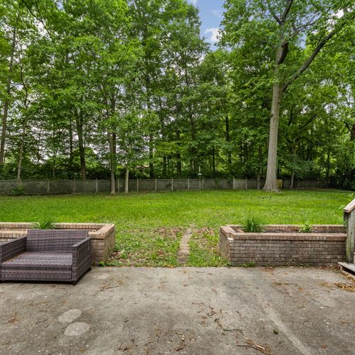 Backyard views: We have an entrance to the backyard off of the lower level living area, perfect for relaxing and enjoying the summer vibes!