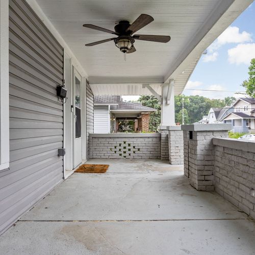 Welcoming front porch with classic charm and keyless entry for easy self check-in!