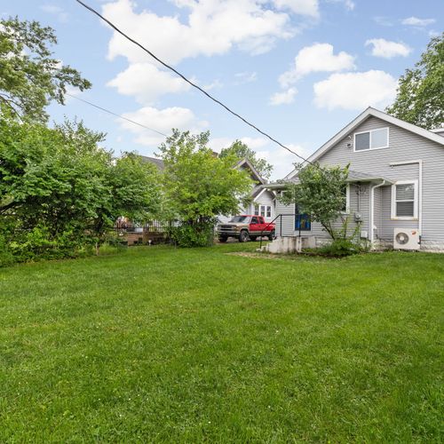 Got it! Here's an updated caption:

Large backyard with plenty of green space — ideal for yard games, lounging, or letting the kids run around.